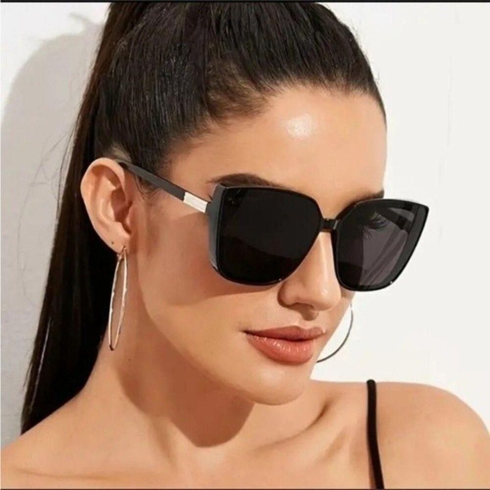 Black sunglasses with gold accent on the side